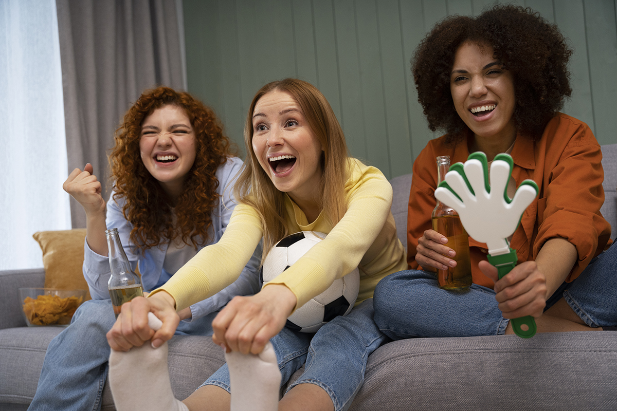group-female-friends-home-watching-sports-together